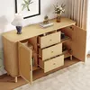 A light wood sideboard with open drawers and a cabinet door, displaying various items inside. Voir les images du produit