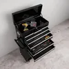 A black tool cart with its top lid open, revealing a drill and a set of drill bits. Several drawers are pulled out, showing various tools like wrenches and screwdrivers. Voir les images du produit