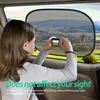 A young girl is taking a picture of the landscape through a car window with a sunshade. Produktbild-Vorschau