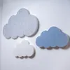 Three cloud-shaped acoustic panels mounted on a white wall. Produktbild-Vorschau