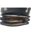 The image shows the interior of a black Guess handbag. Produktbild-Vorschau