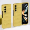 Two yellow phone cases for a foldable phone are displayed on a white and light gray surface. Produktbild-Vorschau