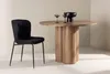 A dining table and chair set in a minimalist setting. Produktbild-Vorschau