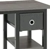 A close-up view of a gray fabric drawer with a white ring pull on a side table. Produktbild-Vorschau