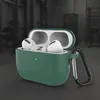 A dark green silicone case for AirPods Pro 3 with a carabiner attached, showing the earbuds inside. Produktbild-Vorschau