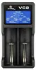 A close-up, front-facing view of a black battery charger with a blue digital display. Anteprima dell’immagine prodotto