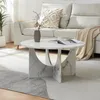 A living room scene with a couch, coffee table, and rug. Voir les images du produit
