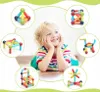 A child is lying on the floor, surrounded by circular insets showing different magnetic building block creations. Voir les images du produit
