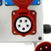 A close-up view of an industrial electrical outlet with a red protective cover. Produktbild-Vorschau