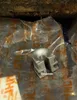 A metal part is shown on top of plastic packaging with the STIHL logo. Produktbild-Vorschau
