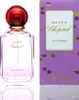 A perfume bottle and its packaging are displayed side-by-side against a white background. Voir les images du produit