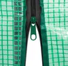 A close-up view of a green zipper on a transparent, grid-patterned material. Produktbild-Vorschau