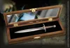 A decorative letter opener in a wooden display box, with a map in the background. Anteprima dell’immagine prodotto