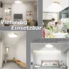 Collage of images showing a modern LED ceiling light in various home settings, including a living room, hallway, kitchen/dining area, and bedroom. Voir les images du produit