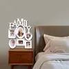 A multi-photo frame collage spelling out 'FAMILY' is displayed on a wall above a wooden nightstand next to a bed. Produktbild-Vorschau