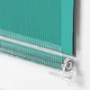 Close-up view of a turquoise roller blind mechanism and fabric. Produktbild-Vorschau