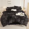 A bedroom scene with a plush bed set. Anteprima dell’immagine prodotto