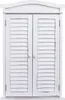 A white wooden cabinet with louvered doors and a decorative arched top, presented against a white background. Náhľad obrázku produktu