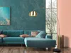 A modern living room with a teal sofa and a gold arc floor lamp. Anteprima dell’immagine prodotto