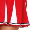 Close-up of the hem of a red and white pleated skirt with black and white trim. Produktbild-Vorschau