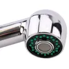 Close-up of a chrome faucet head with green nozzles. Produktbild-Vorschau