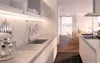 A modern, well-lit kitchen with white countertops and cabinets, featuring an under-cabinet LED light. Produktbild-Vorschau