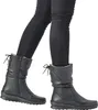A person wearing black pants and black boots, shown from the knees down, walking against a white background. Podgląd zdjęcia produktu