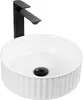 A white ceramic washbasin with a black faucet. Produktbild-Vorschau