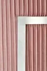A close-up view of a pleated pink fabric with a silver border. Anteprima dell’immagine prodotto