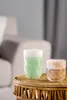 Two glasses of drinks on a woven table in a living room setting. Anteprima dell’immagine prodotto
