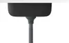 Underside of a black sink with a gray drainpipe attached. Náhľad obrázku produktu