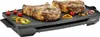 A large electric grill with two large steaks and some vegetables on it. Anteprima dell’immagine prodotto