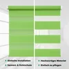 A split image showing two views of a green and white striped roller blind. The left side shows the blind fully closed, and the right side shows it partially open, revealing the striped pattern. Text descriptions are present at the bottom of each side. Produktbild-Vorschau