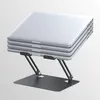 A stack of silver laptops on a black adjustable stand against a light gray background. Podgląd zdjęcia produktu