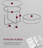 An exploded diagram of a round coffee table with labeled parts, along with text about easy assembly and an open instruction manual. Produktbild-Vorschau