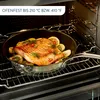 A salmon fillet is being cooked in a pan inside an oven. Anteprima dell’immagine prodotto