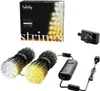 A product shot of Twinkly Strings LED lights, including the packaging, lights, and power adapter. Náhled obrázku produktu