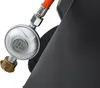A close-up view of a gas regulator attached to an orange gas hose, connected to a dark gray appliance. Produktbild-Vorschau
