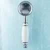 A close-up shot of a shower head with water running. Podgląd zdjęcia produktu