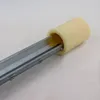 A close-up shot of a yellow roller on a metal track, likely part of a fence or gate system. Voir les images du produit