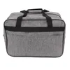 A gray sewing machine storage bag with black handles and trim, shown from the front. Náhľad obrázku produktu