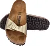 A pair of gold Birkenstock sandals on a white background. Voir les images du produit
