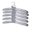 A stack of gray padded hangers with silver bows. Produktbild-Vorschau