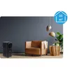 A modern living room scene with a portable air conditioner, a leather armchair, and a wooden side table. Produktbild-Vorschau