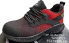 A close-up studio shot of a red and black safety shoe. Produktbild-Vorschau