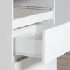 Close-up view of the inside of a white cabinet with two drawers, showing the drawer slides and the interior of the drawers. Produktbild-Vorschau