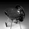 A black kettle-style barbecue grill with a silver rack and legs, shown from a slightly elevated angle. Náhľad obrázku produktu