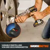 A person is using a cordless impact wrench to remove a lug nut from a car wheel. Podgląd zdjęcia produktu