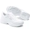 A pair of white Puma Cilia Mode sneakers shown from a slightly elevated side angle against a white background. One shoe is fully visible, while the sole of the other shoe is visible behind it. Podgląd zdjęcia produktu
