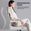 A woman is sitting in a white office chair, with a diagram of a spine next to her. Produktbild-Vorschau